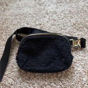 lululemon athletica Black Faux Shearling Belt Bag with Gold Hardware